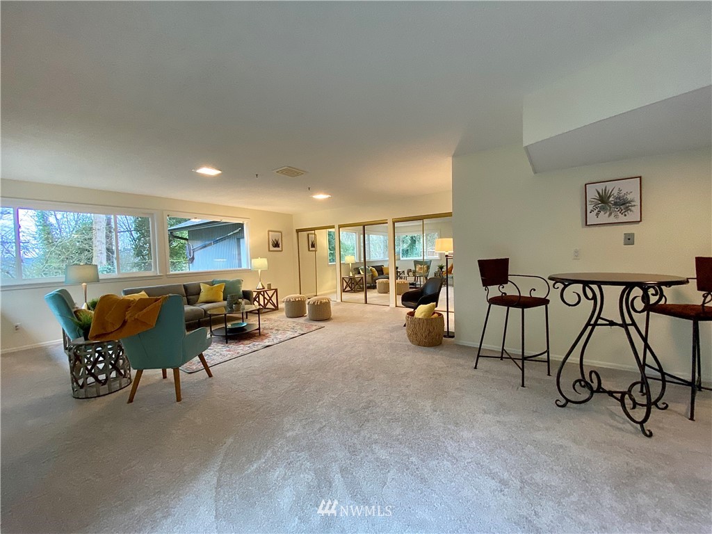14902 175th Avenue Southeast Renton, WA 98059 - Photo 28 of 39 a living room with furniture and a large window