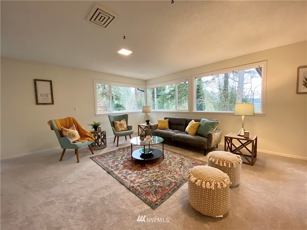 14902 175th Avenue Southeast Renton, WA 98059 - Photo 29 of 39 a living room with furniture and a large window