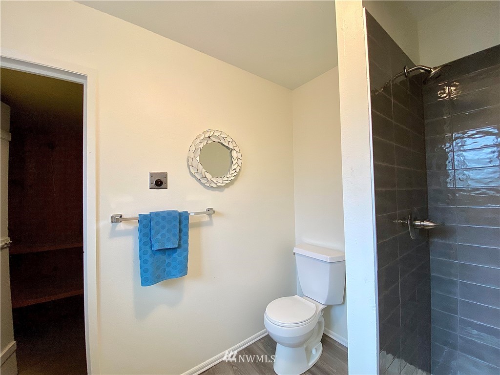 14902 175th Avenue Southeast Renton, WA 98059 - Photo 30 of 39 a bathroom with a toilet and a shower