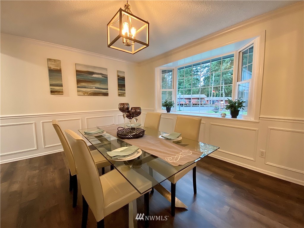 14902 175th Avenue Southeast Renton, WA 98059 - Photo 6 of 39 a view of a dining room with furniture window and outside view