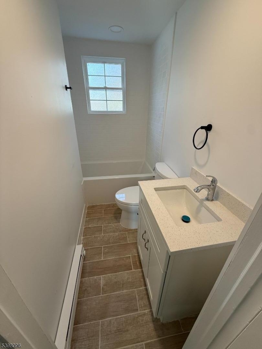 173 Highway 46, Unit 2A Mine Hill, NJ 07803 - Photo 4 of 7 a bathroom with a sink and a mirror