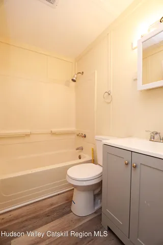 a bathroom with a toilet a sink and a bathtub