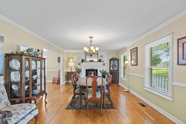 a view of a livingroom with furniture and a flat screen tv