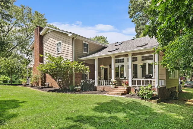 a view of a house with a yard and plants