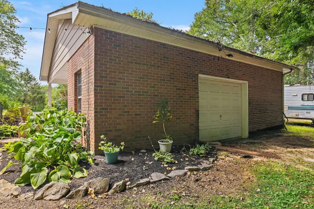 a view of a house with a backyard