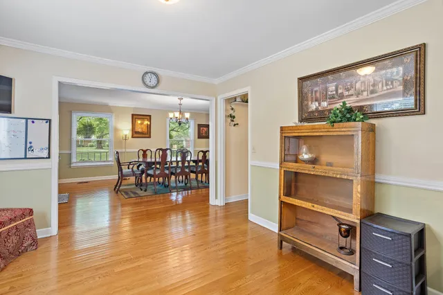 a view of a livingroom with furniture and a flat screen tv