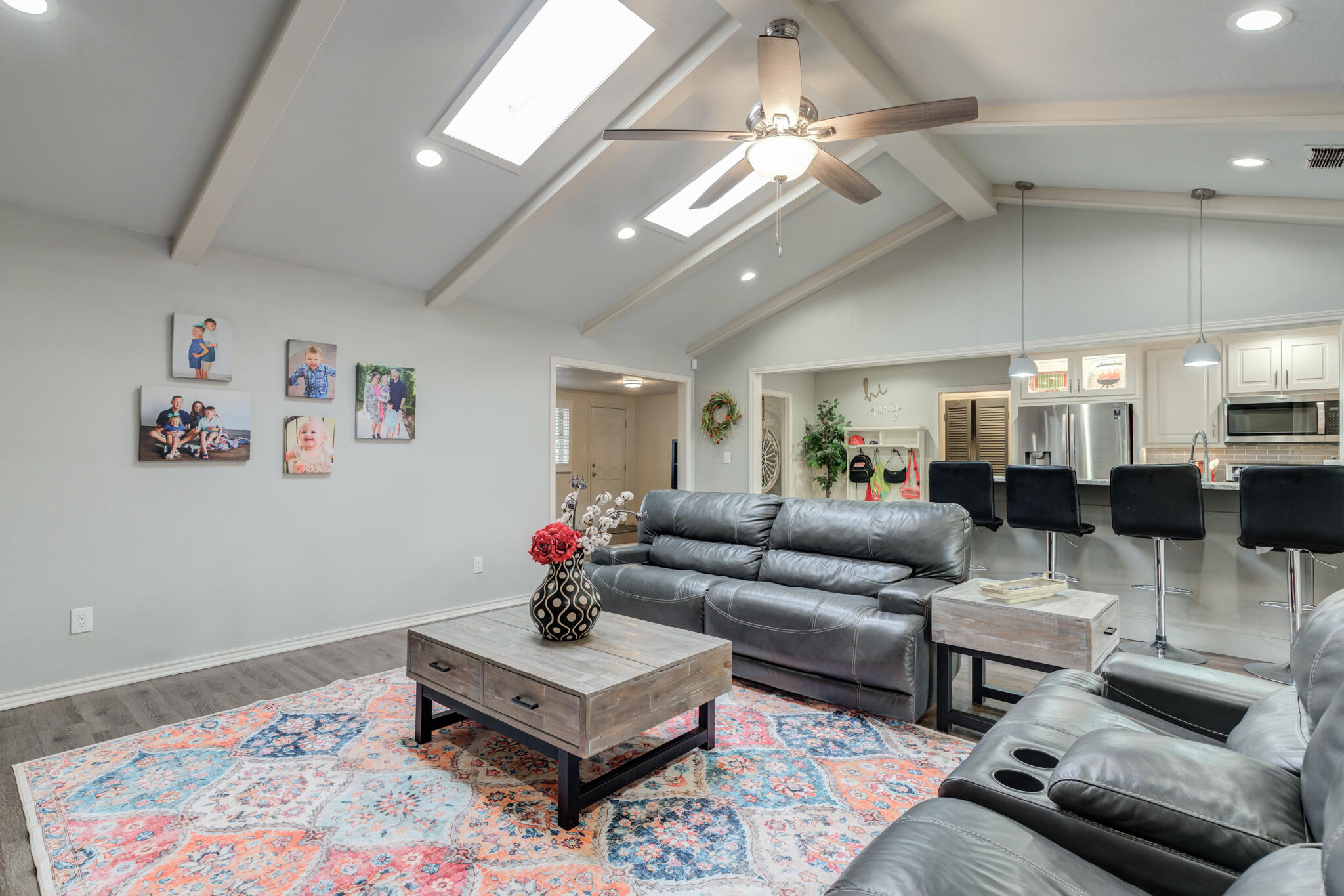 3410 76th Street Lubbock, TX 79423 - Photo 11 of 38 a living room with furniture and a chandelier