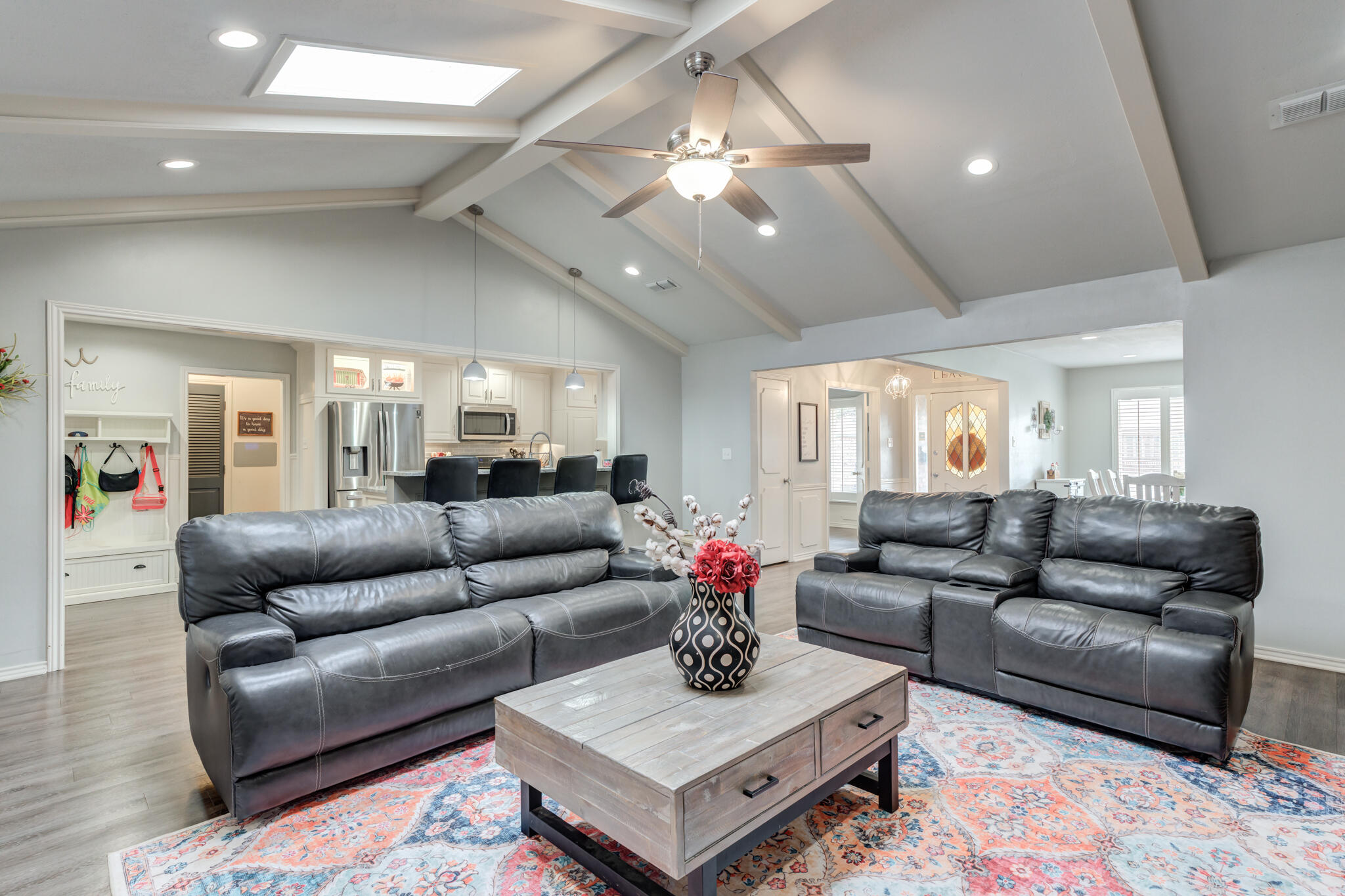 3410 76th Street Lubbock, TX 79423 - Photo 12 of 38 a living room with furniture and a chandelier