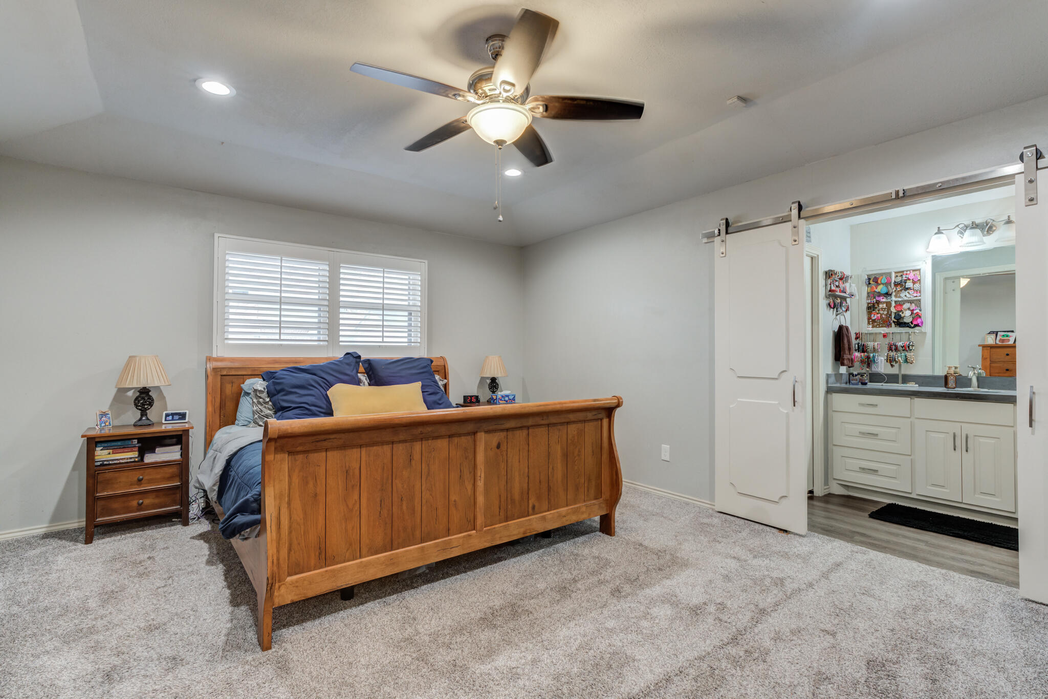 3410 76th Street Lubbock, TX 79423 - Photo 22 of 38 a bed room with a bed and a dresser