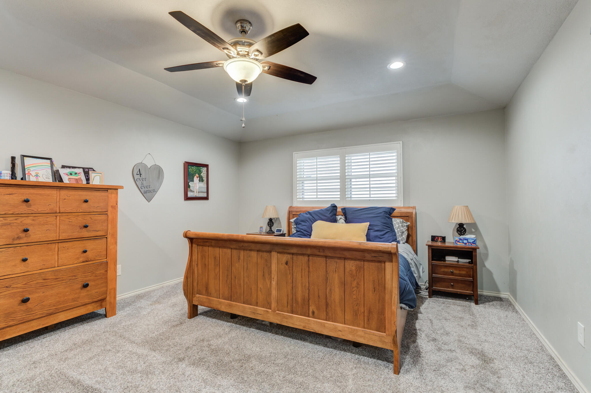 3410 76th Street Lubbock, TX 79423 - Photo 23 of 38 a bed room with a bed and a television