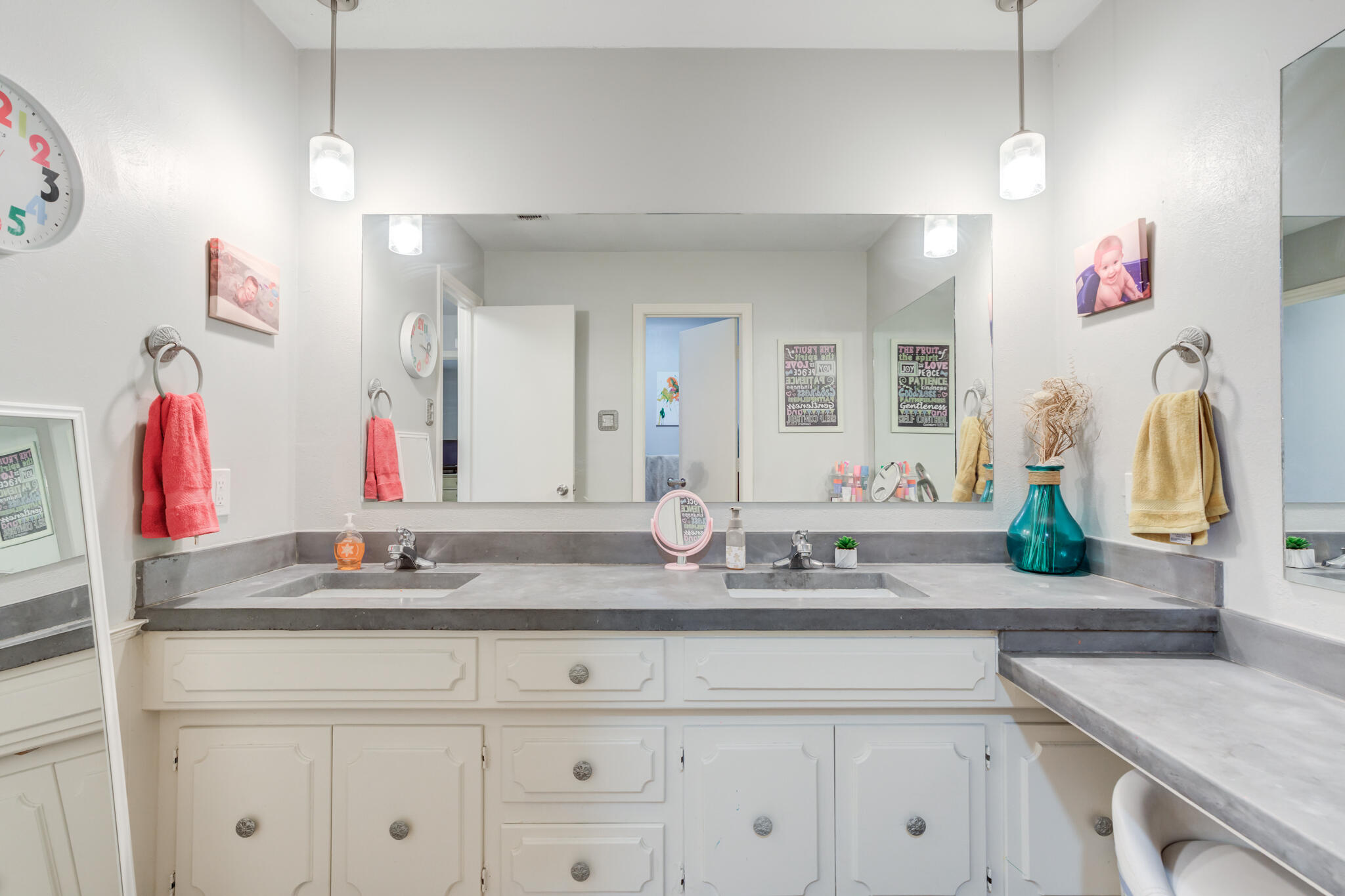 3410 76th Street Lubbock, TX 79423 - Photo 30 of 38 a bathroom with a sink vanity and mirror