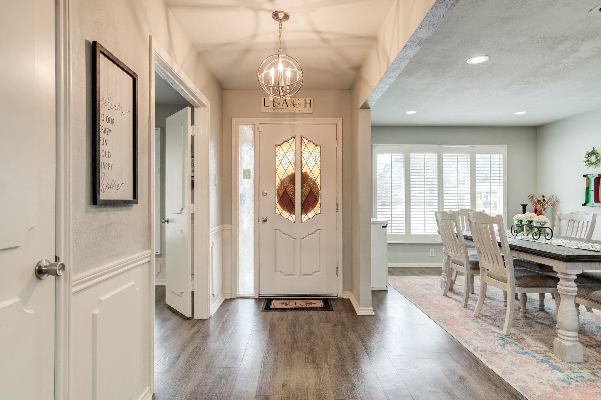 3410 76th Street Lubbock, TX 79423 - Photo 4 of 38 a view of a dining room with furniture window and wooden floor