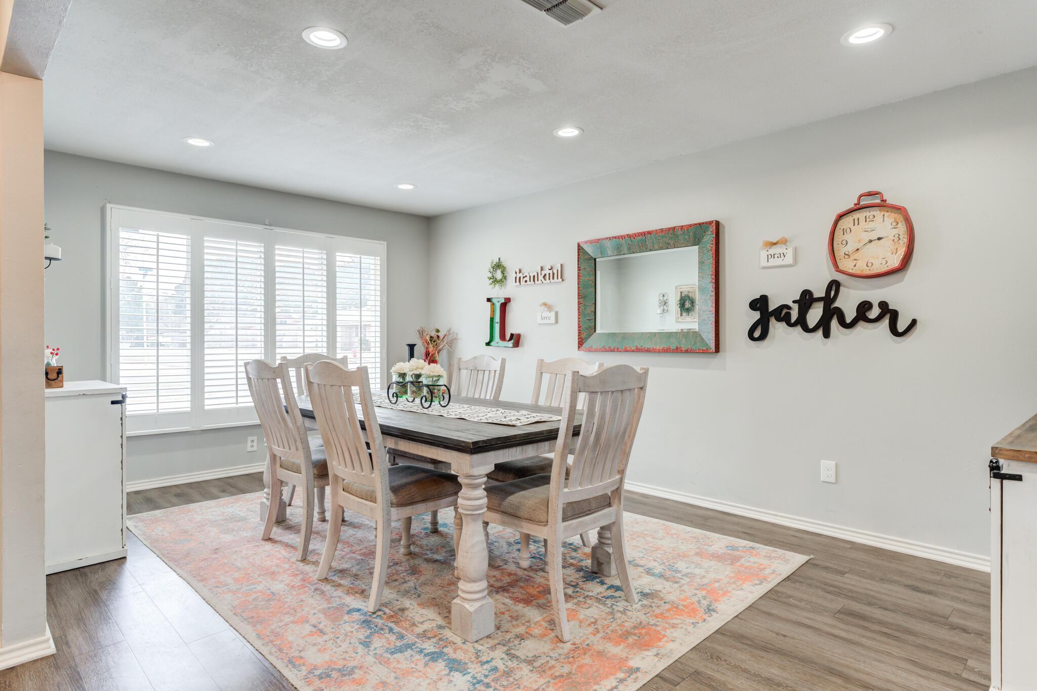 3410 76th Street Lubbock, TX 79423 - Photo 5 of 38 a view of a dining room with furniture window and wooden floor