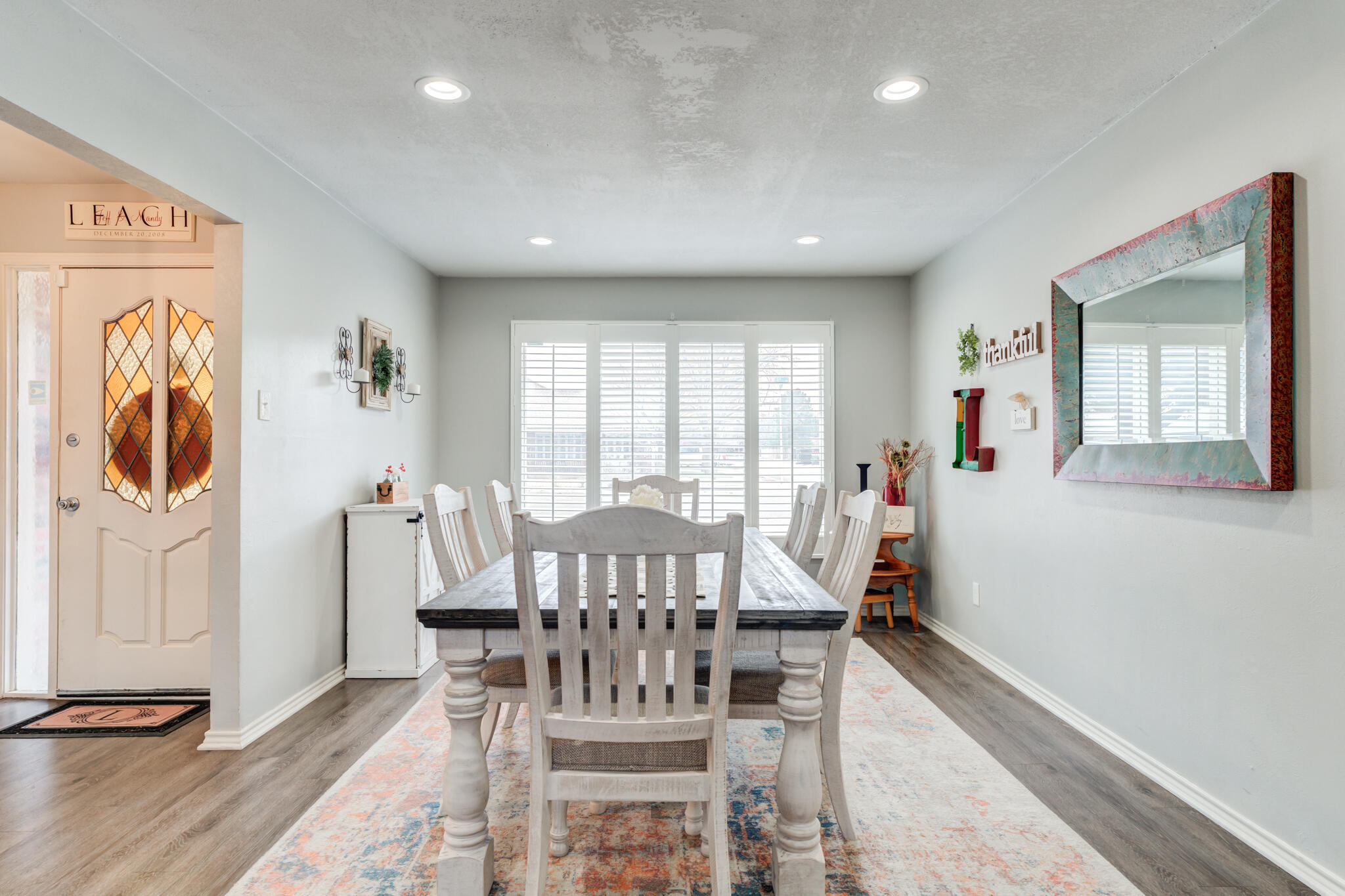 3410 76th Street Lubbock, TX 79423 - Photo 6 of 38 a view of a a dining room with furniture window and wooden floor