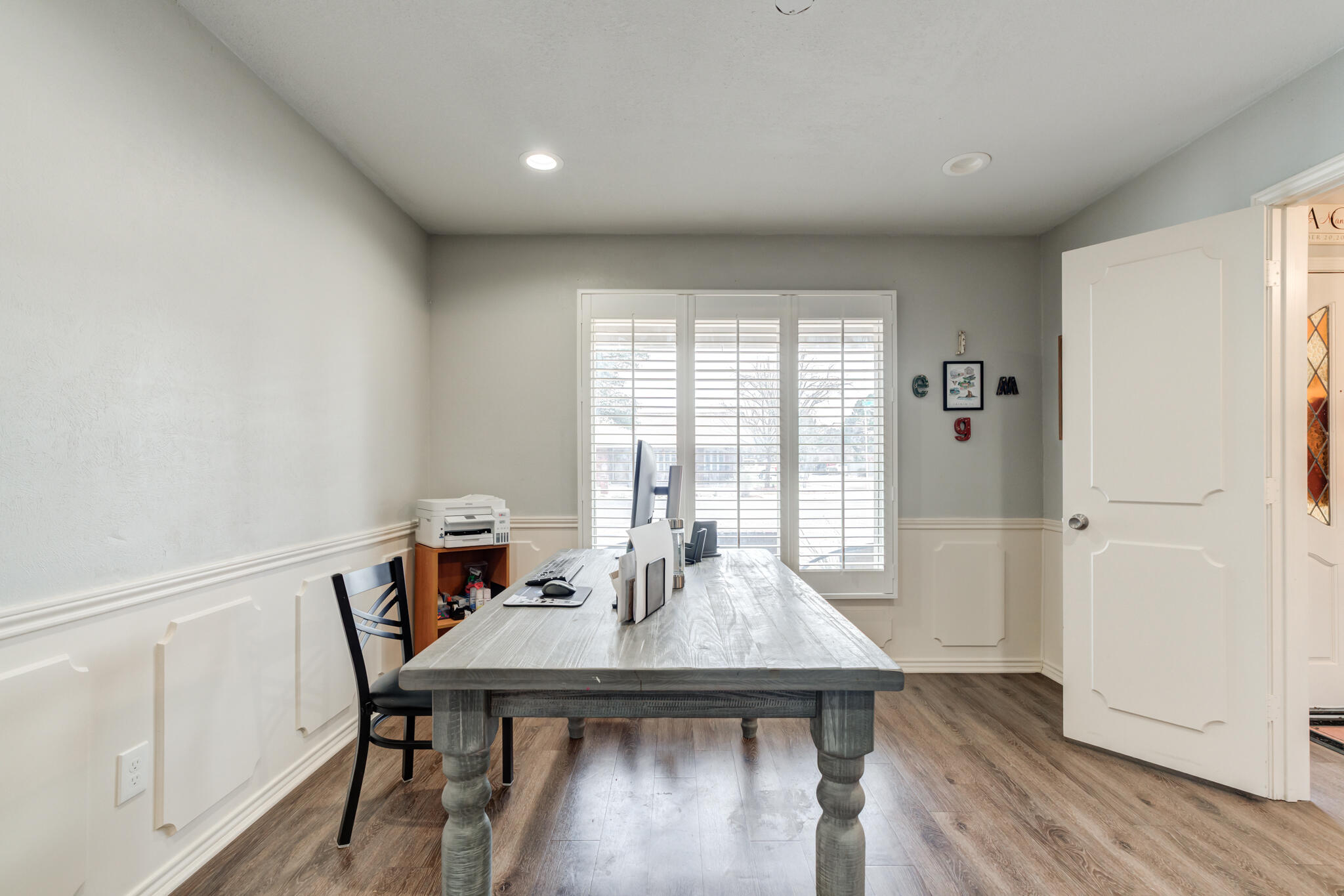 3410 76th Street Lubbock, TX 79423 - Photo 8 of 38 a view of a dining room with furniture window and wooden floor
