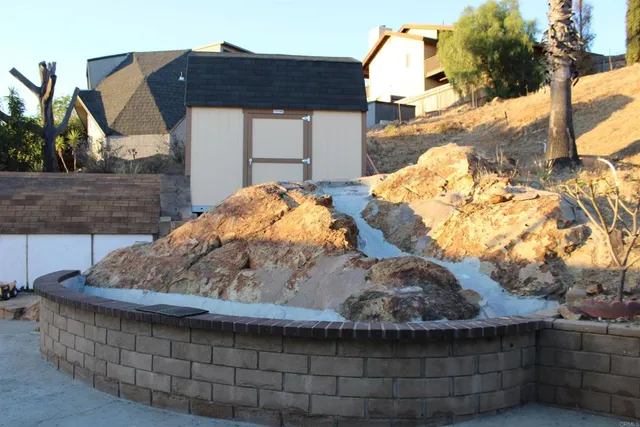 a backyard of a house with garage