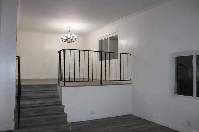 a white toilet sitting next to a shower