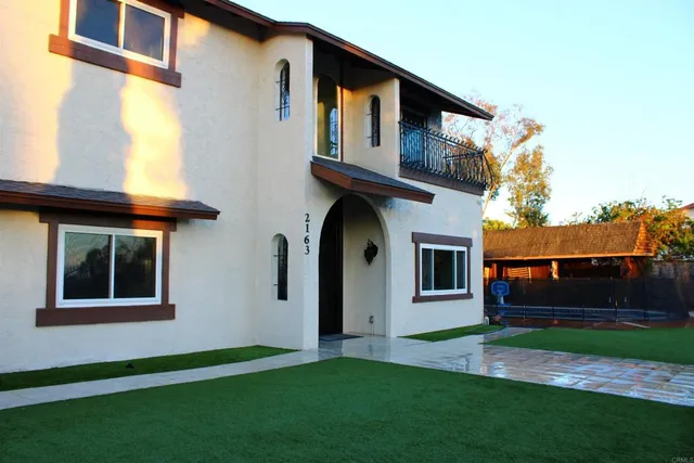 a front view of a house with a yard