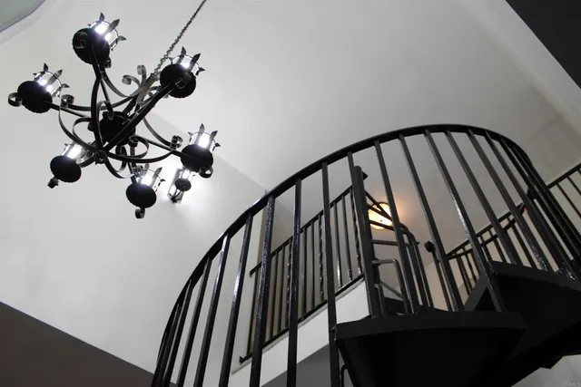 a view of staircase with wooden floor