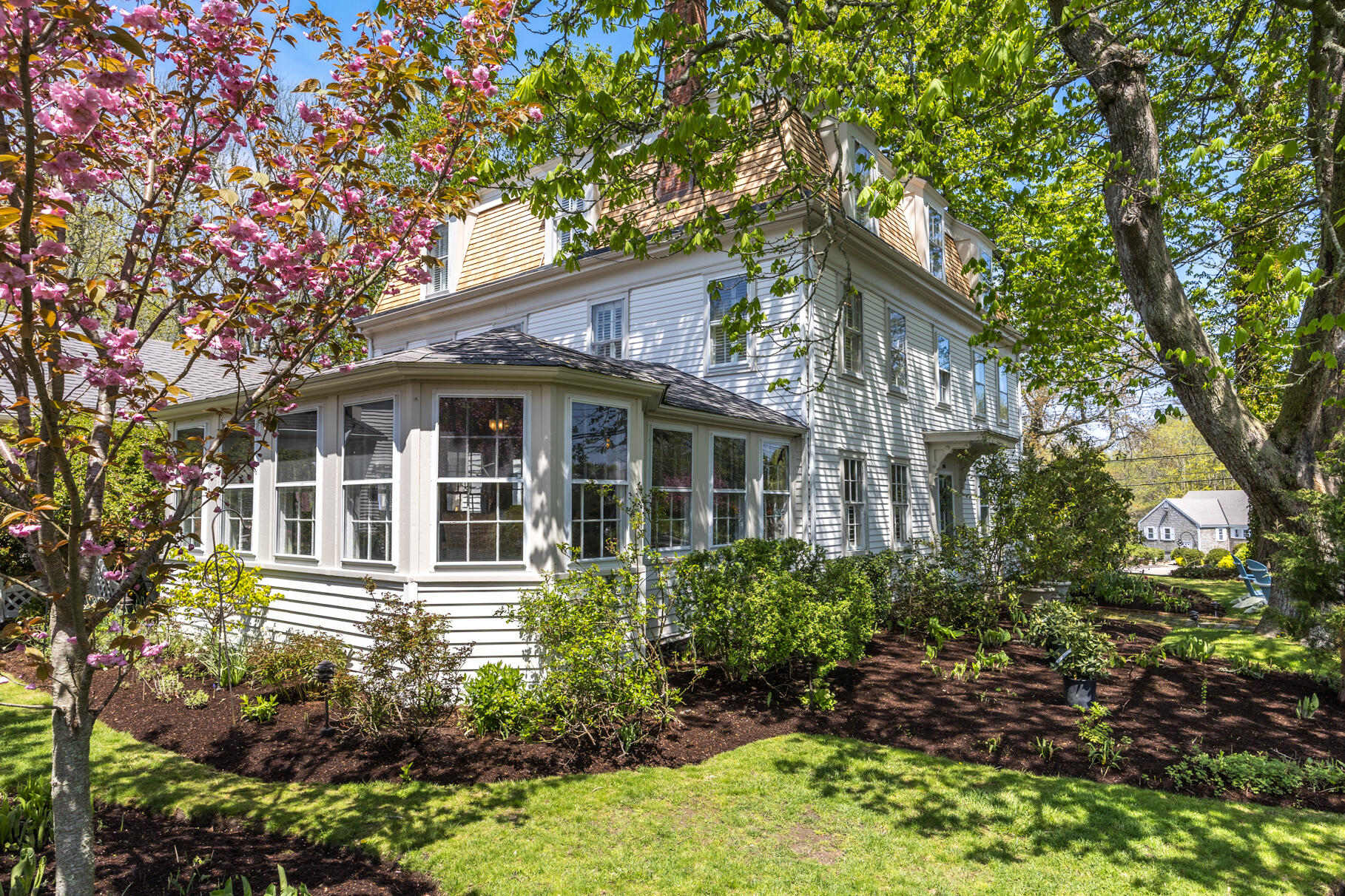 1861 Main Street Brewster, MA 02631 - Photo 11 of 65 a front view of a house with a garden
