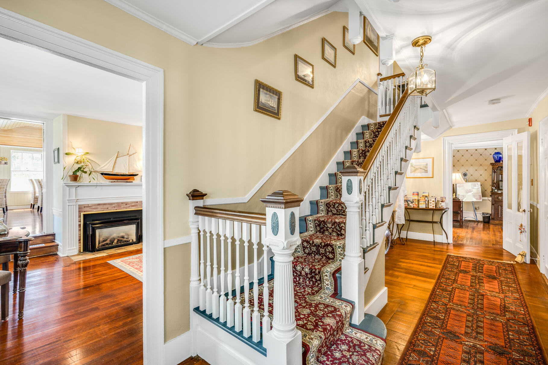 1861 Main Street Brewster, MA 02631 - Photo 12 of 65 a view of a livingroom with wooden floor and a fireplace