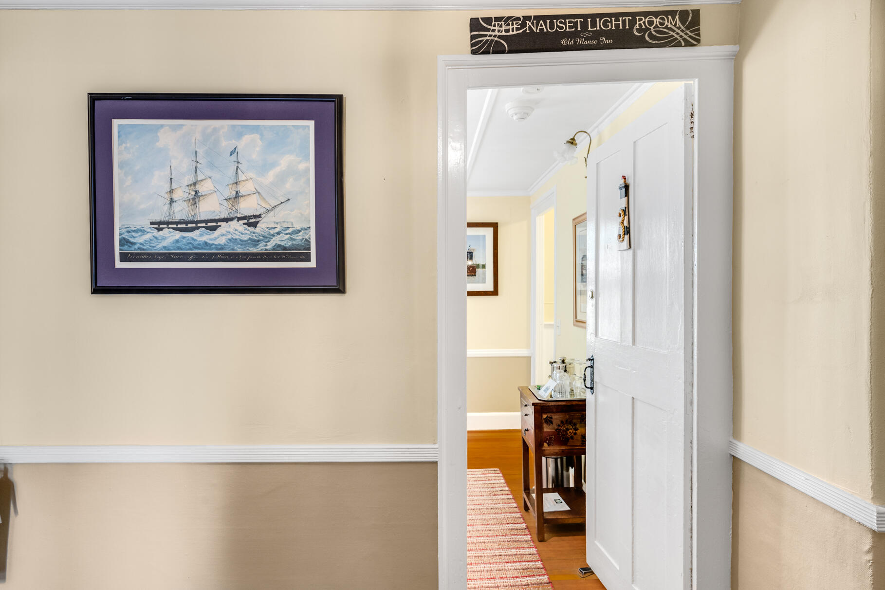 1861 Main Street Brewster, MA 02631 - Photo 18 of 65 a view of a hallway with wooden floor and a bathroom