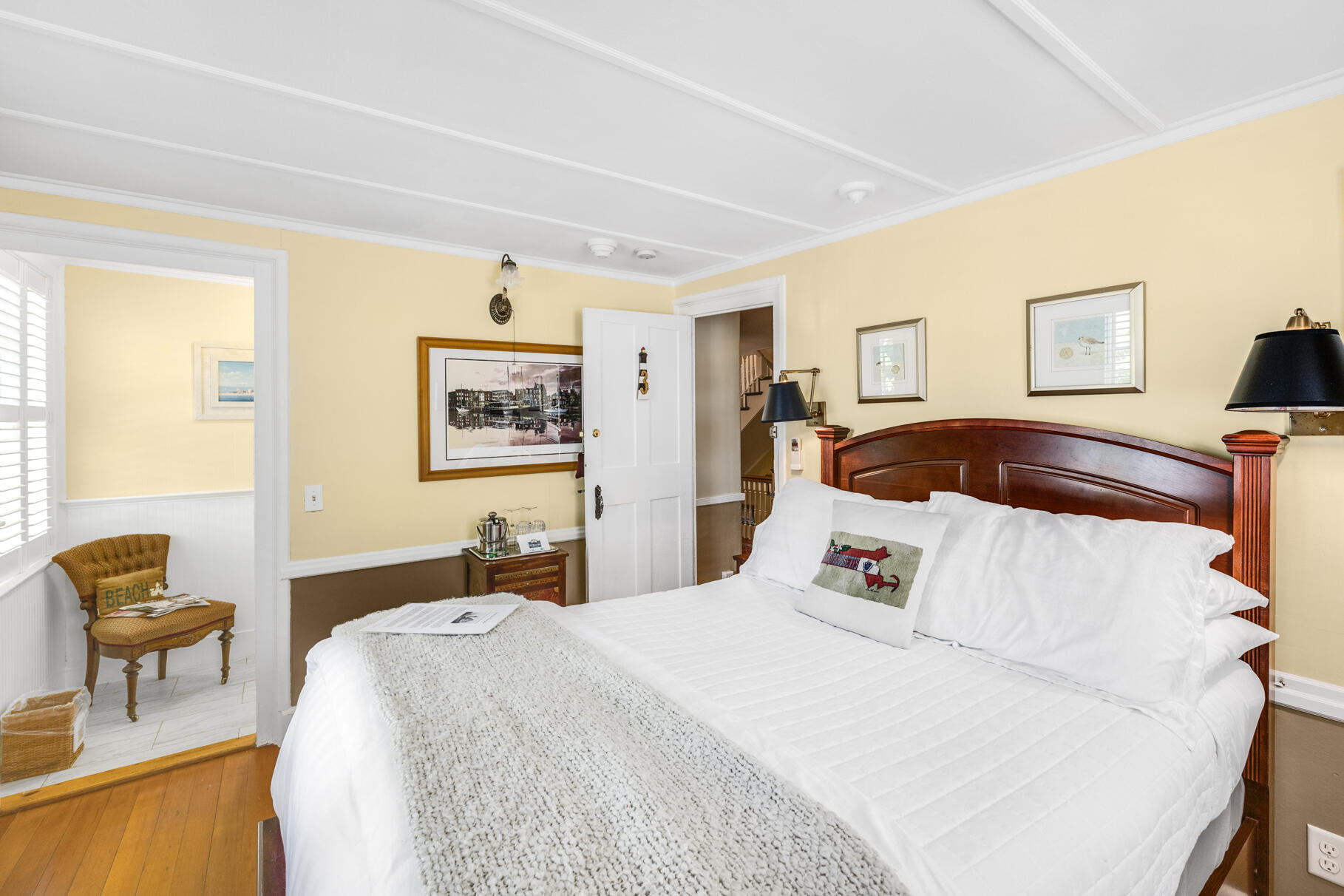 1861 Main Street Brewster, MA 02631 - Photo 19 of 65 a bedroom with a bed and wooden floor