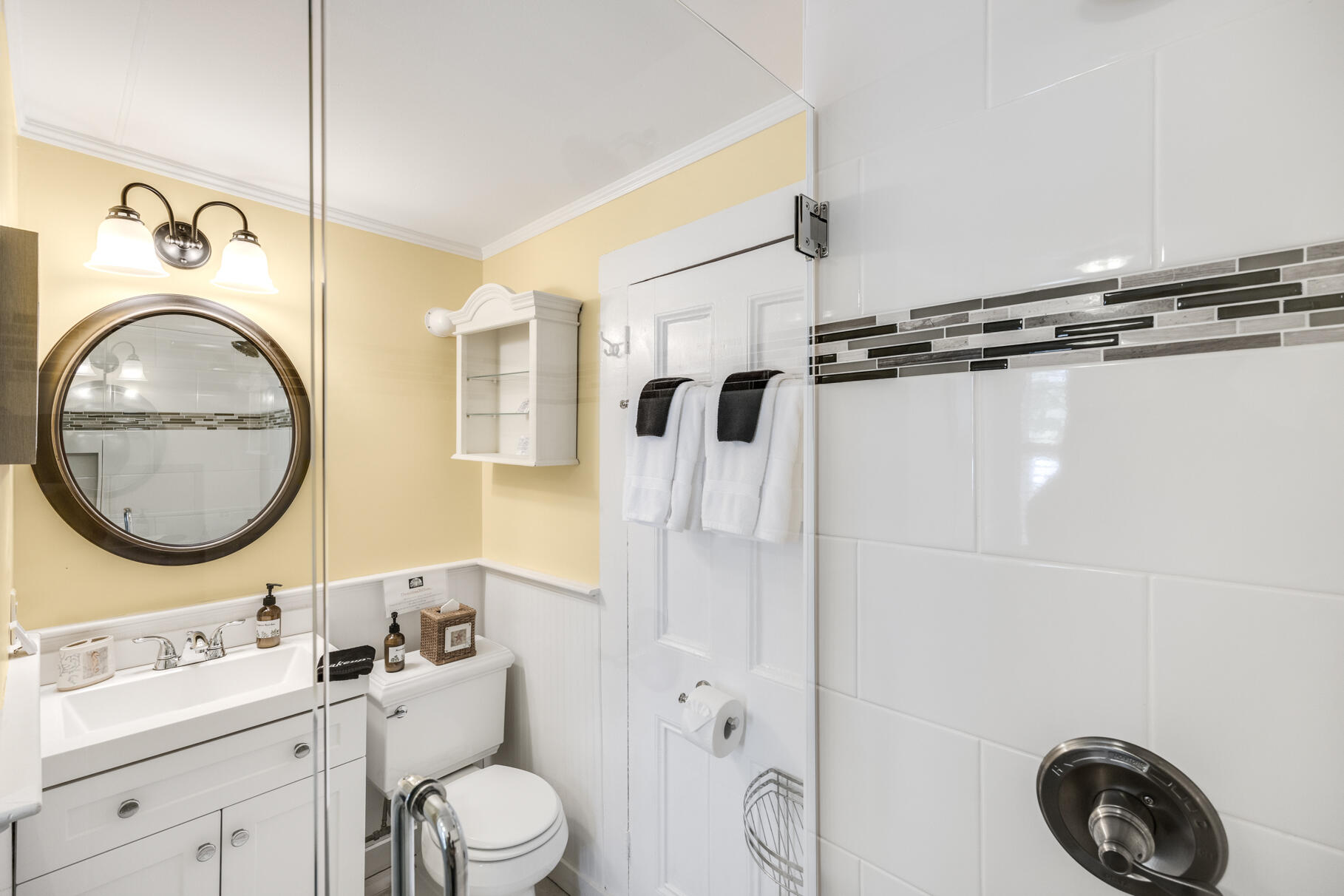 1861 Main Street Brewster, MA 02631 - Photo 20 of 65 a bathroom with a toilet a sink and a mirror