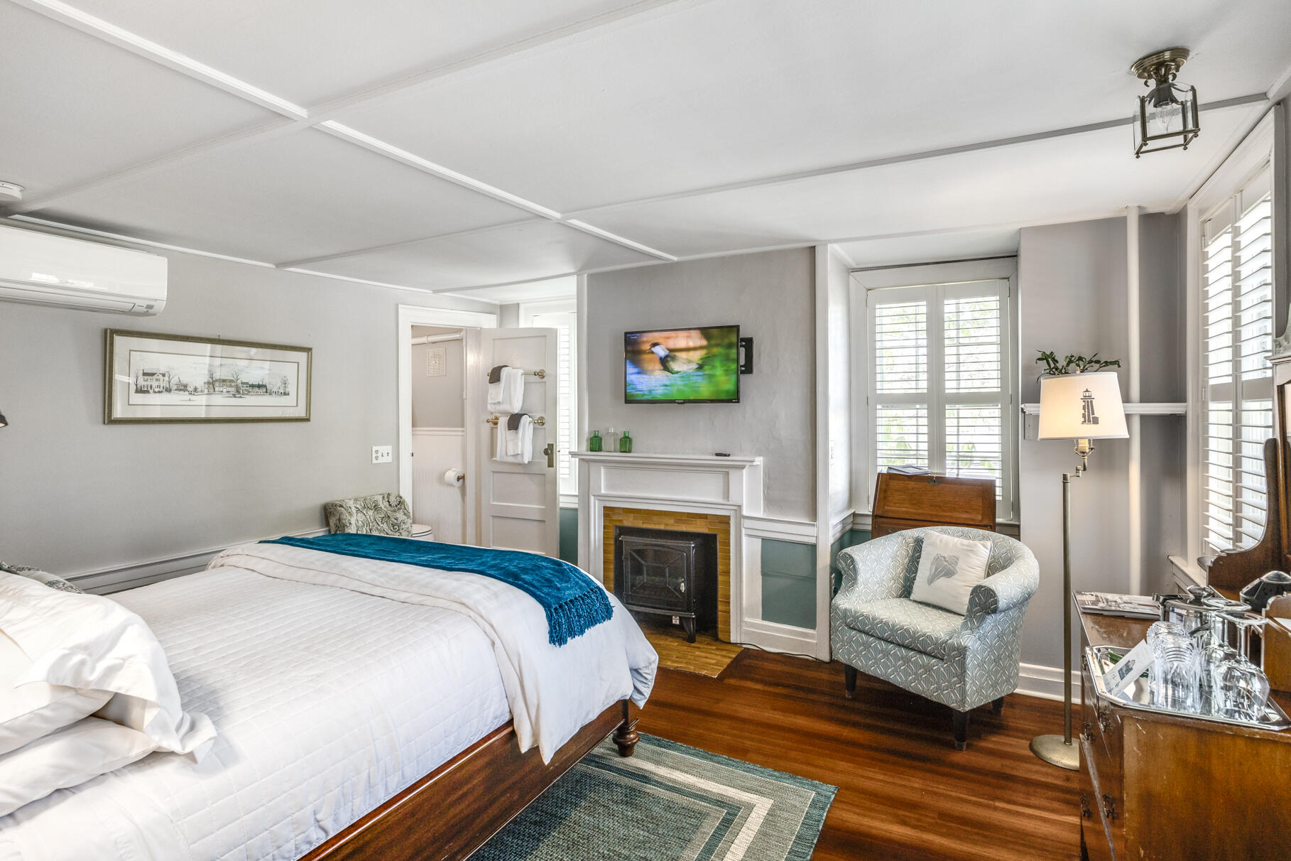 1861 Main Street Brewster, MA 02631 - Photo 21 of 65 a spacious bedroom with a bed and a couch