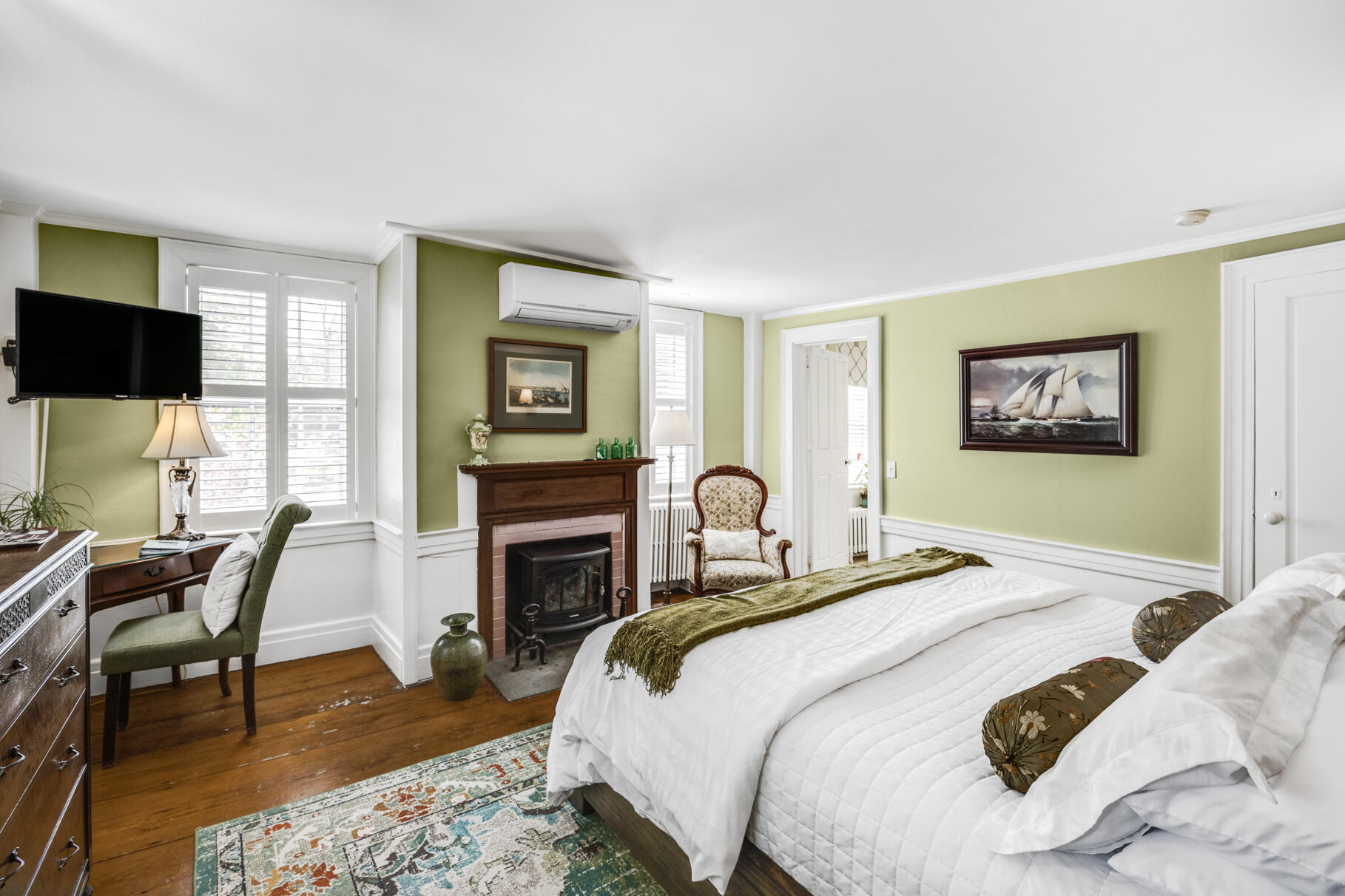 1861 Main Street Brewster, MA 02631 - Photo 24 of 65 a bedroom with a bed and a flat screen tv
