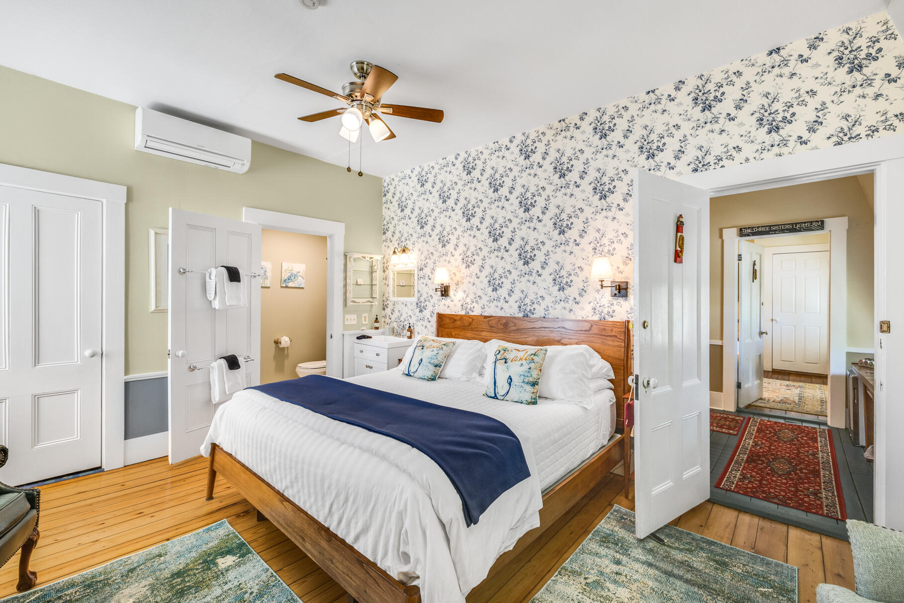 1861 Main Street Brewster, MA 02631 - Photo 36 of 65 a bedroom with a bed and a chandelier