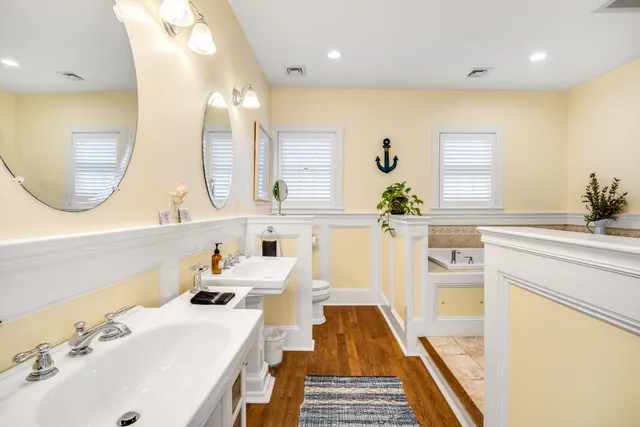 a kitchen with a table chairs stove and cabinets