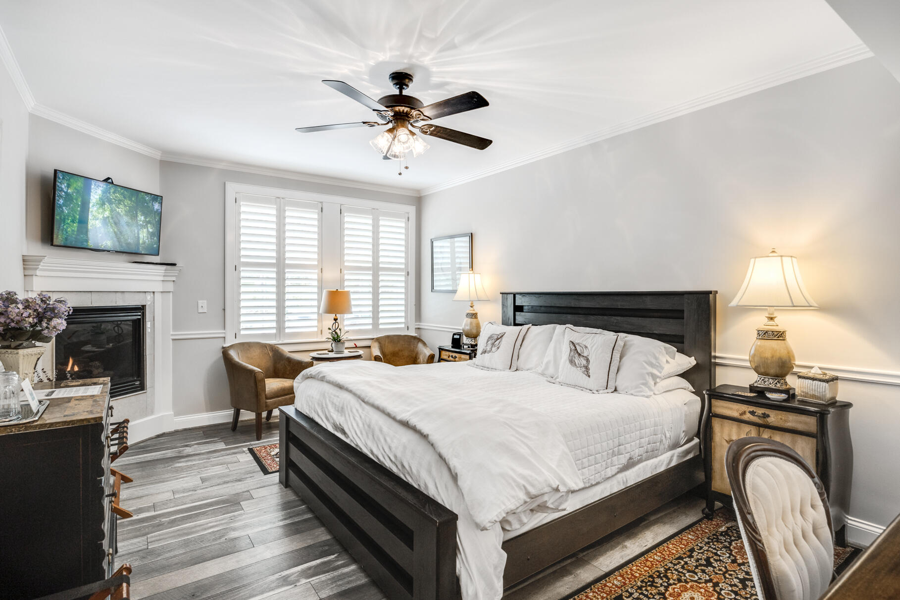 1861 Main Street Brewster, MA 02631 - Photo 42 of 65 a bedroom with a bed and a chandelier