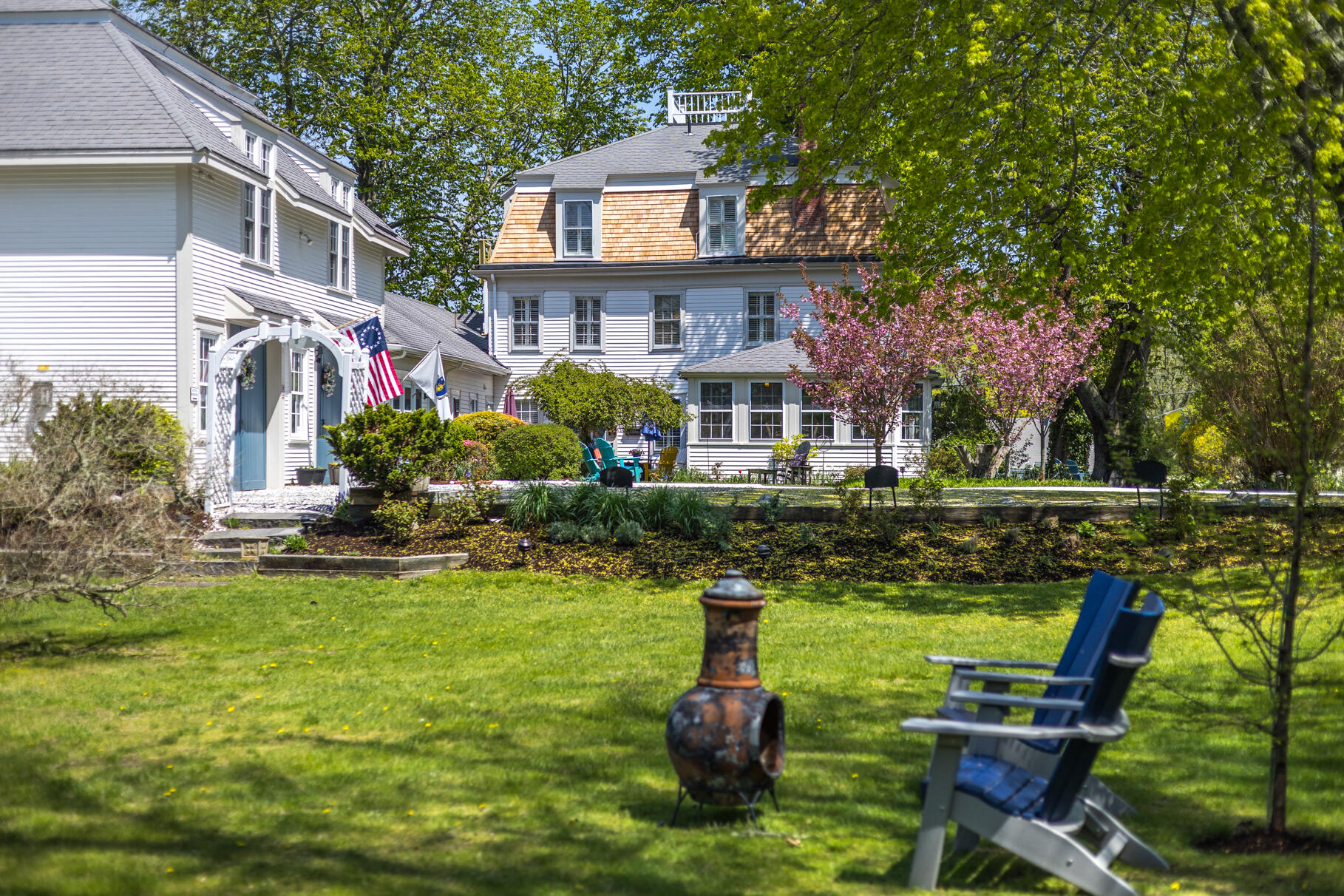1861 Main Street Brewster, MA 02631 - Photo 47 of 65 a front view of house with yard and outdoor seating