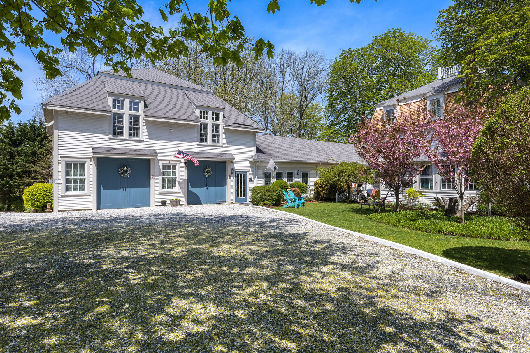 1861 Main Street Brewster, MA 02631 - Photo 48 of 65 a front view of a house with a yard and garage