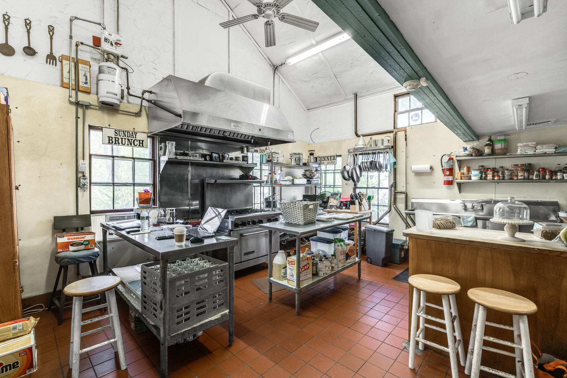 1861 Main Street Brewster, MA 02631 - Photo 49 of 65 a kitchen with a table chairs stove and cabinets