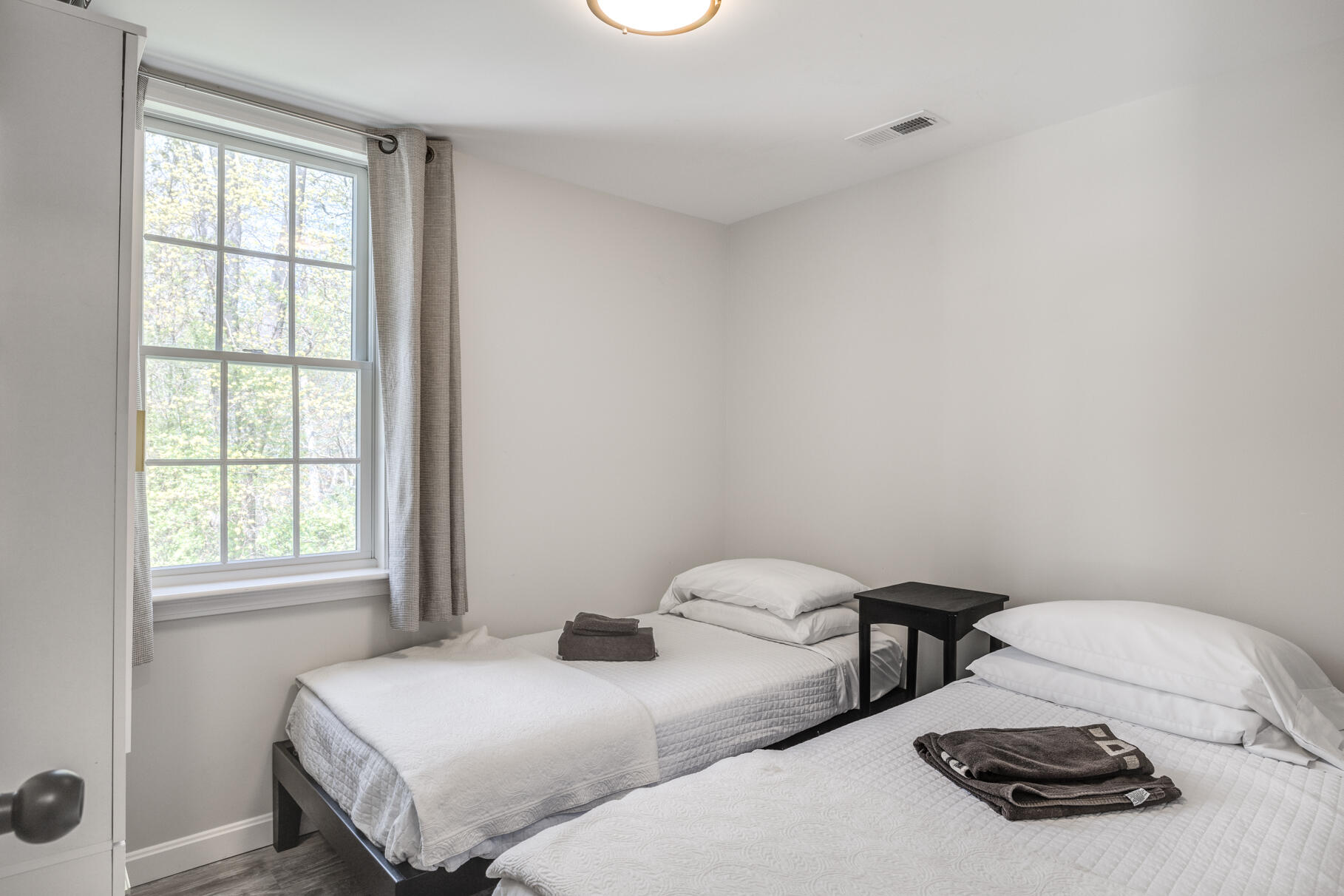 1861 Main Street Brewster, MA 02631 - Photo 50 of 65 a bedroom with two beds and a window