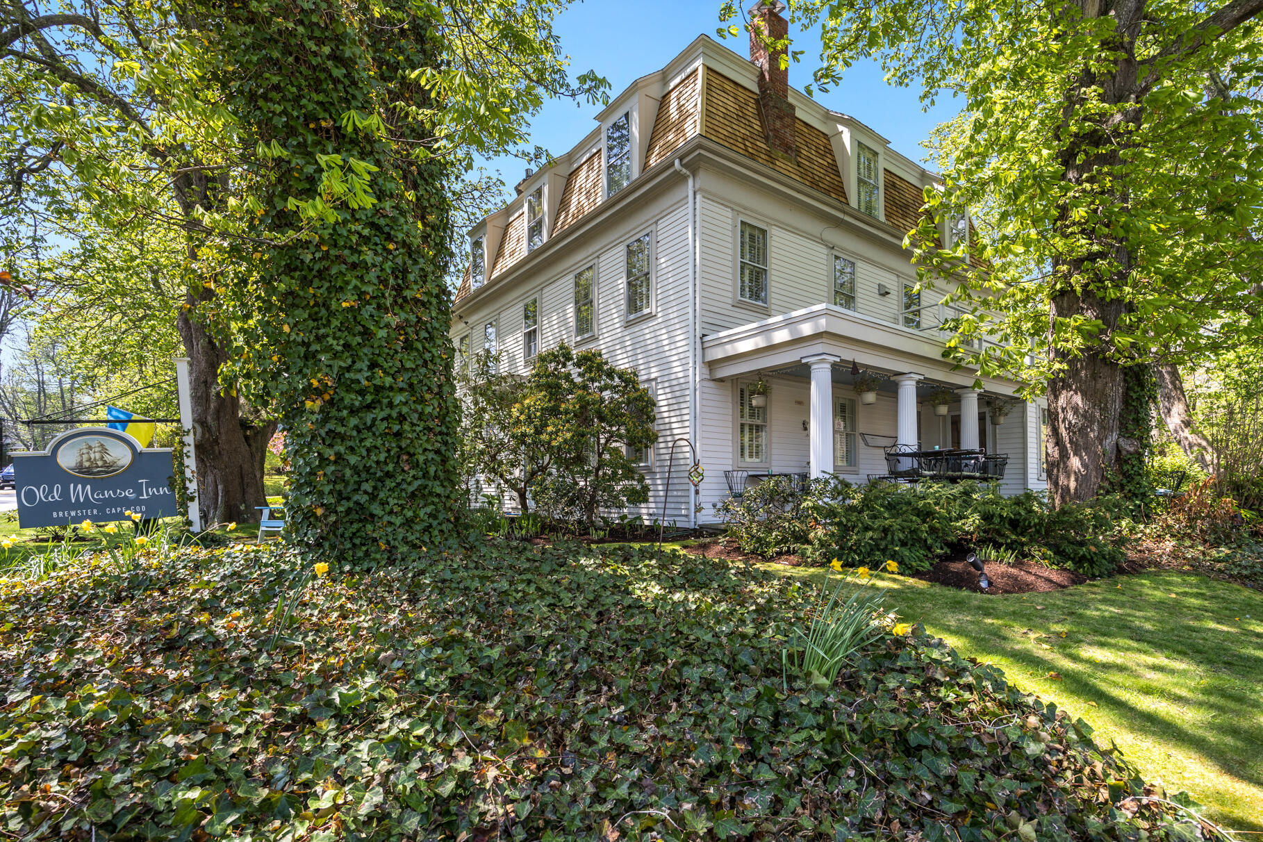 1861 Main Street Brewster, MA 02631 - Photo 52 of 65 a front view of a house with garden