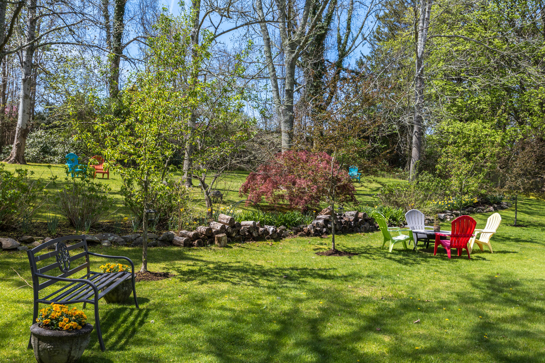 1861 Main Street Brewster, MA 02631 - Photo 55 of 65 a backyard of a house with lots of green space and fountain