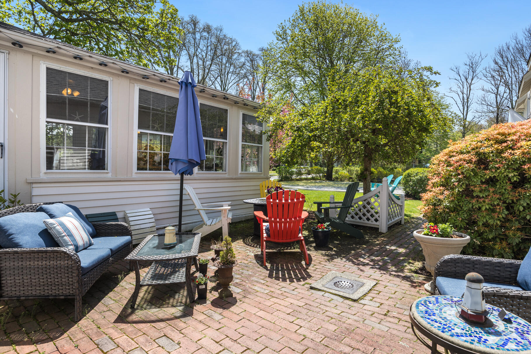 1861 Main Street Brewster, MA 02631 - Photo 56 of 65 a backyard of a house with outdoor seating