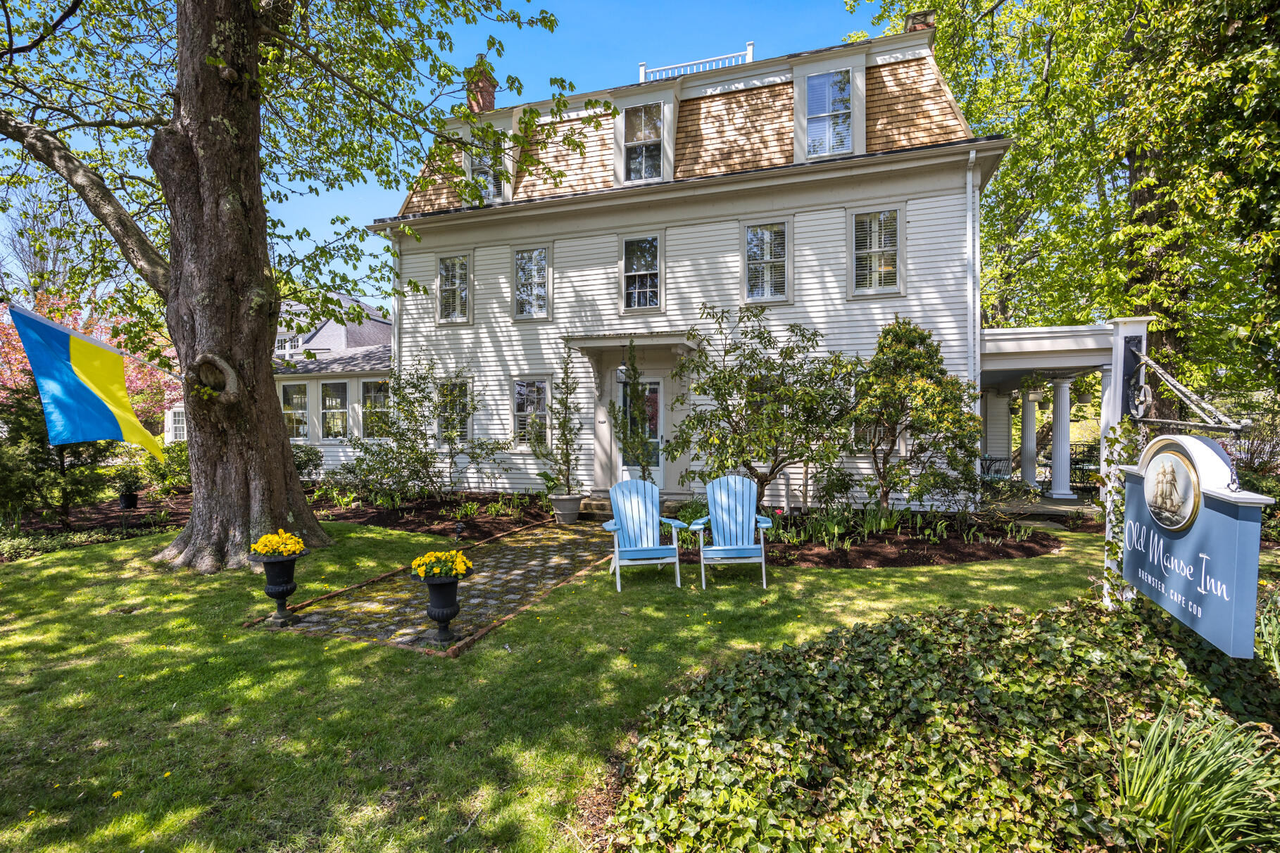 1861 Main Street Brewster, MA 02631 - Photo 57 of 65 a front view of a house with garden