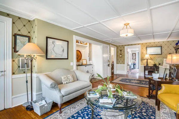 a living room with furniture and a table