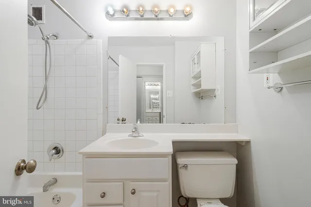 a bathroom with a sink a toilet and a bathtub