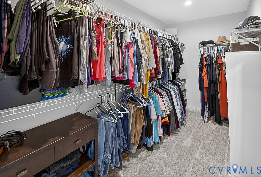 18517 Palisades Ridge Moseley, VA 23120 - Photo 24 of 55 a view of walk in closet with clothes