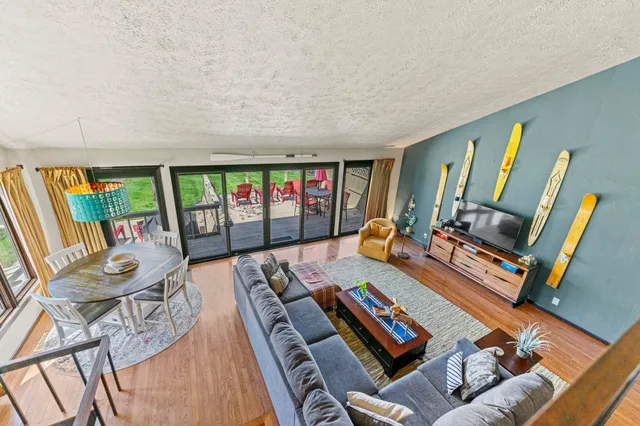 a bed sitting in a bedroom next to a lamp