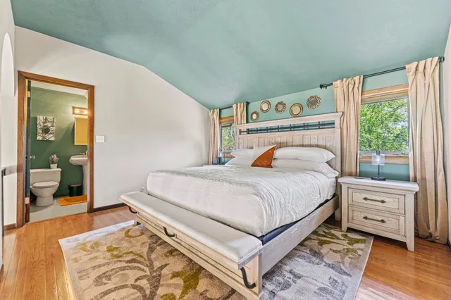 a bathroom with a sink toilet and mirror