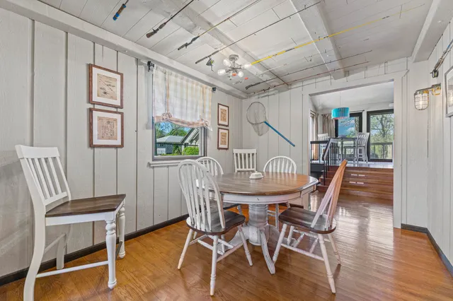 a kitchen with stainless steel appliances kitchen island granite countertop a refrigerator and a sink