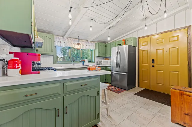 a kitchen with stainless steel appliances granite countertop a sink and a stove