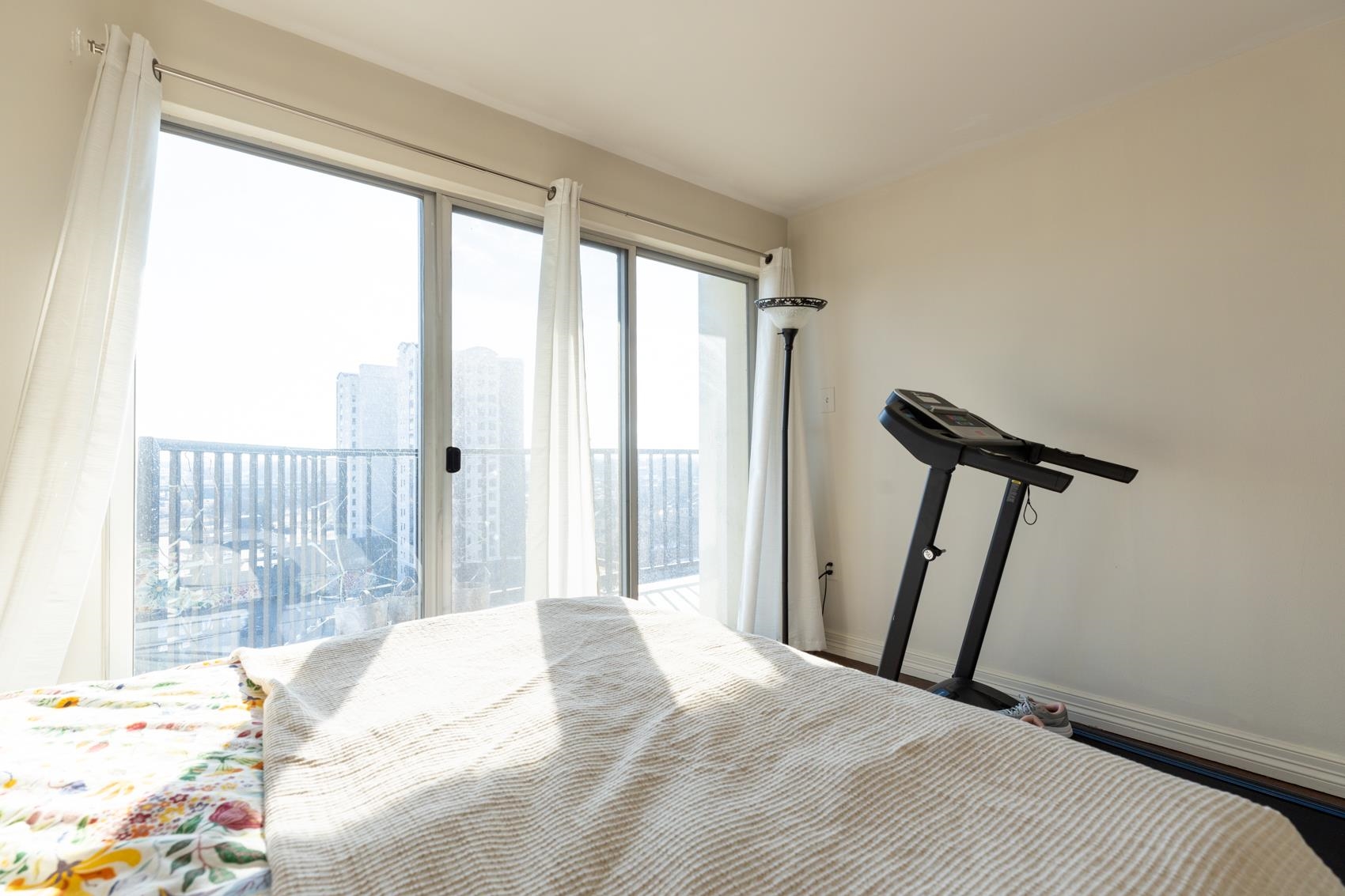 655 Riverside Drive, Unit 1008A Memphis, TN 38103 - Photo 2 of 10 Bedroom featuring a view of skyline and access to exterior