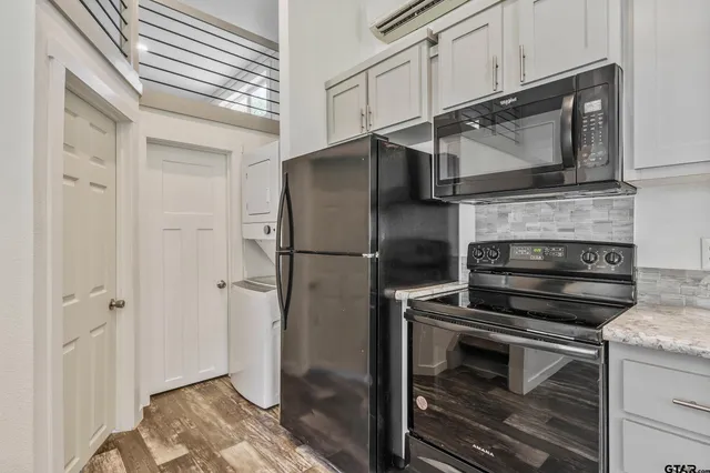 a kitchen with appliances and cabinets